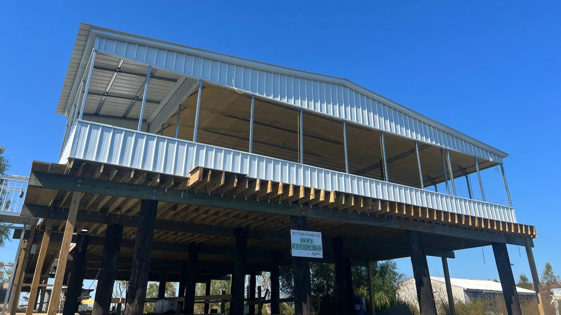huge metal building with wooden foundation